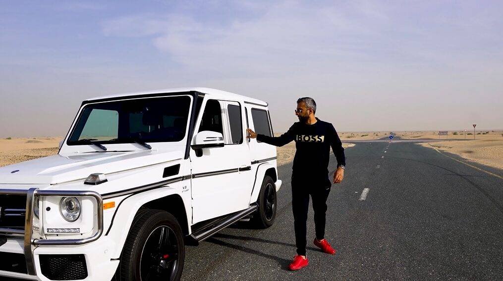 Adeel Chowdhry in Boss tee shirt stepping out of G-Wagon in Dubai